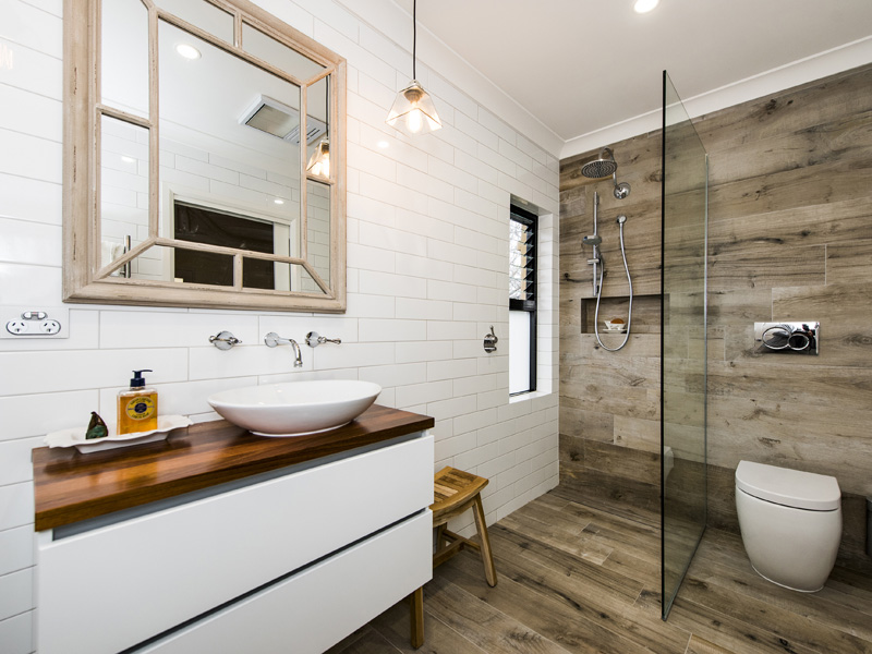 Bathroom wood like finish floors used also in the shower because of their waterproof nature.