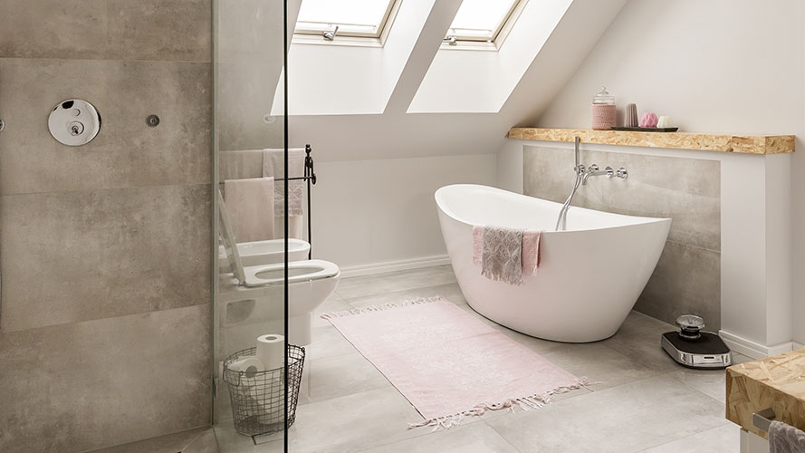 bathroom with bath toilet and concrete floor