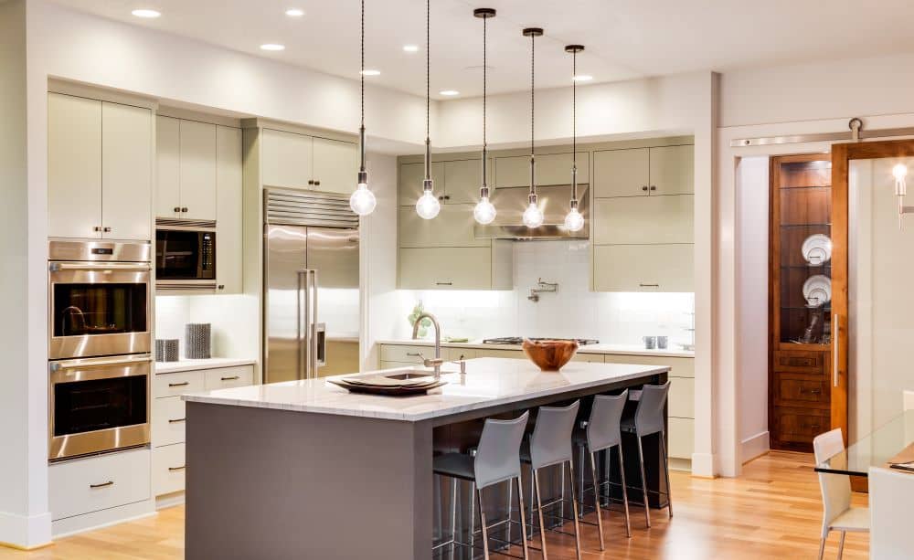 Modern kitchen with pendant lights. 