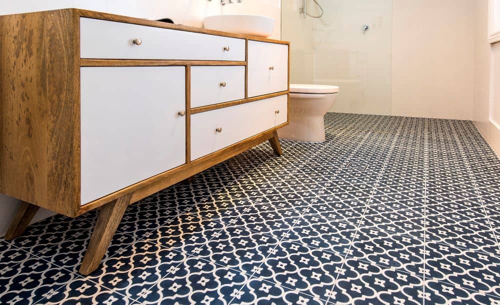 Bathroom with blue and white tiles.