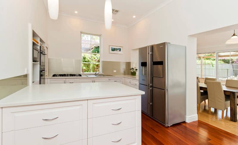 Furnished kitchen and dining area.