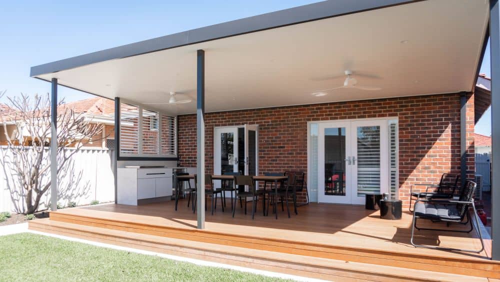 An outdoor kitchen often doubles as an outdoor dining area, living room, and entertainment space.